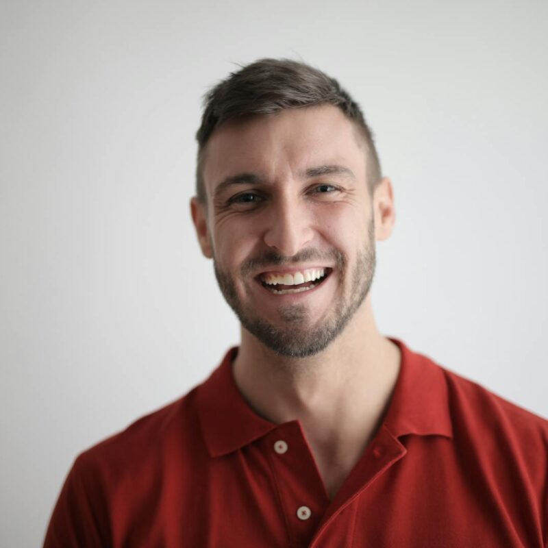 Man in Red Button Up Shirt Smiling