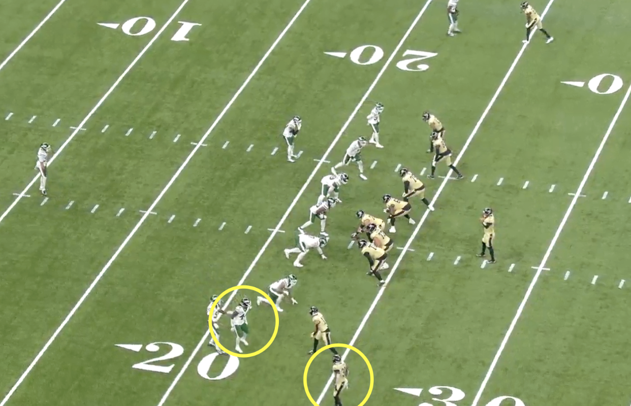 Saints football play drawn near the 20-yard line, with Chris Olave and another player marked by yellow circles.