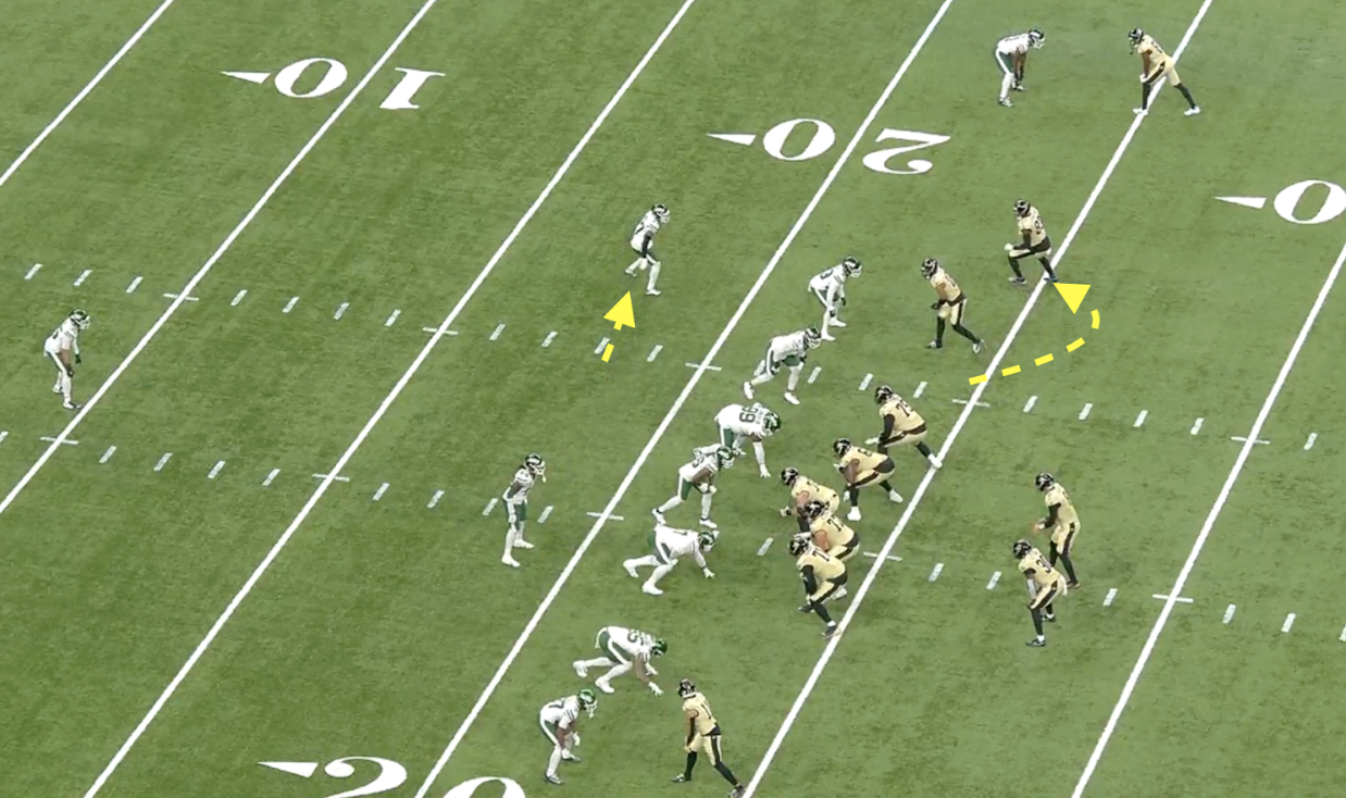 Players line up near the 20-yard line as yellow arrows highlight Saints receiver Chris Olave’s intended route.