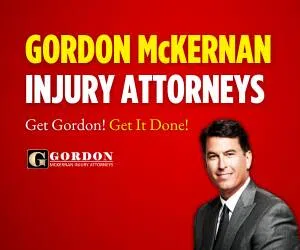 Ad featuring Gordon McKernan, a man in a suit on a red background with the slogan, "Get Gordon! Get It Done!.
