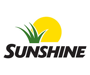 A yellow sun peeks out from behind green grass above bold black "SUNSHINE" text, all set against a white background.
