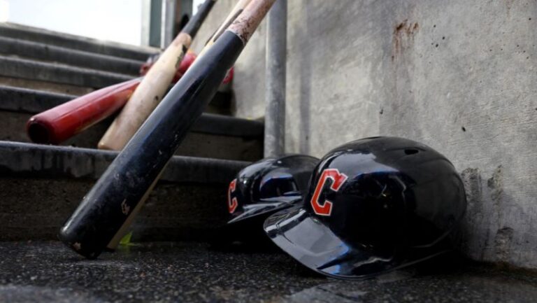 Two helmets with a red "C" and three wooden bats rest on concrete steps, left there by Logan Schmidt before Monday’s deadline.