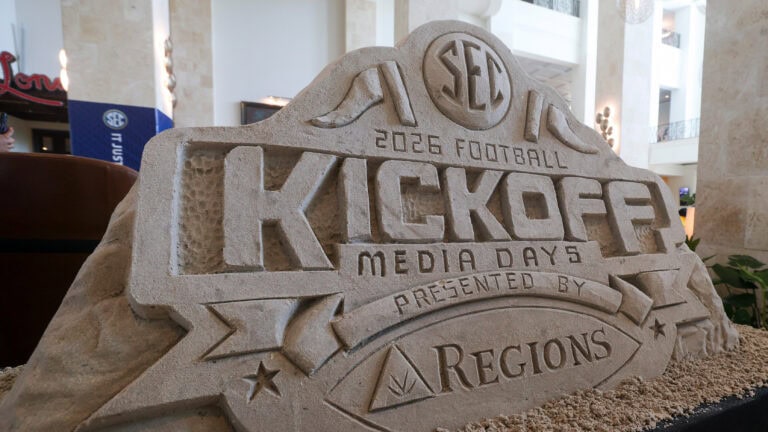 A sand sculpture for SEC Media Day 2026 stands indoors with columns and balconies behind, spotlighting the event before voting ends.