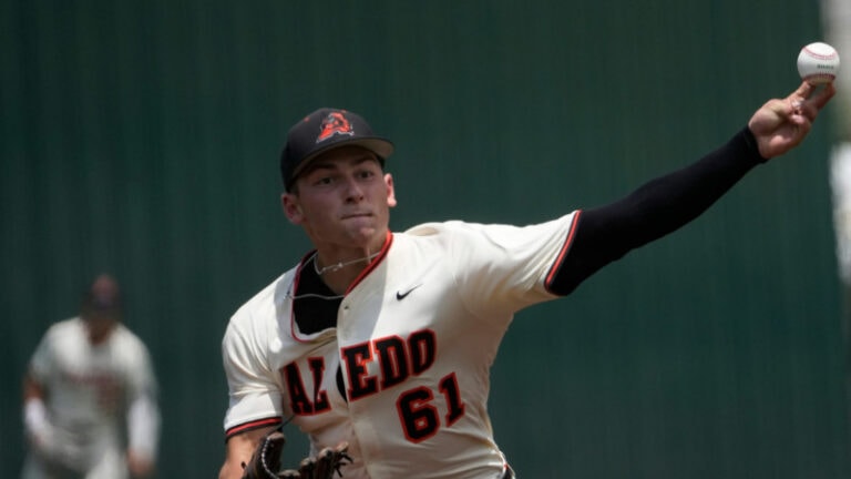 A baseball pitcher in a white Aledo uniform, number 61, throws a pitch with another player seen in the background.