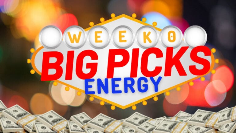 A sign saying “Week 0 Big Picks Energy” is shown with money and lights in front and colorful blurred lights behind.