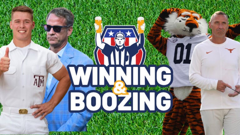 Four men, a coach, and a tiger mascot stand on grass holding a “Winning & Boozing” sign, celebrating SEC football.