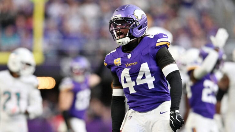 A Minnesota Vikings player wearing number 44 shouts on the field during a game against the Saints.